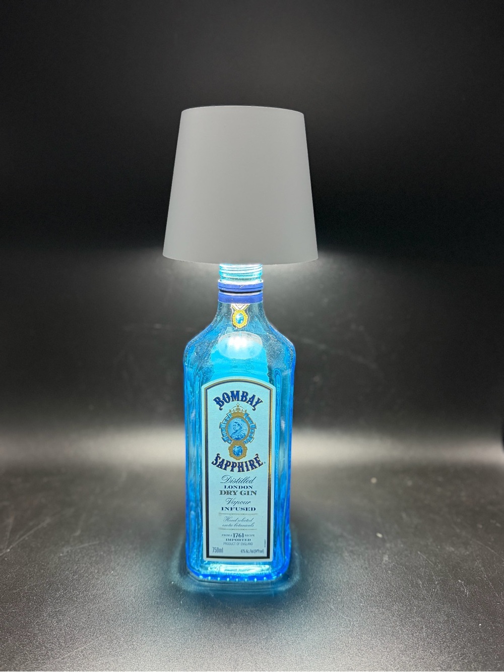 Repurposed Bombay Saphore bottle with rechargeable usb lamp top